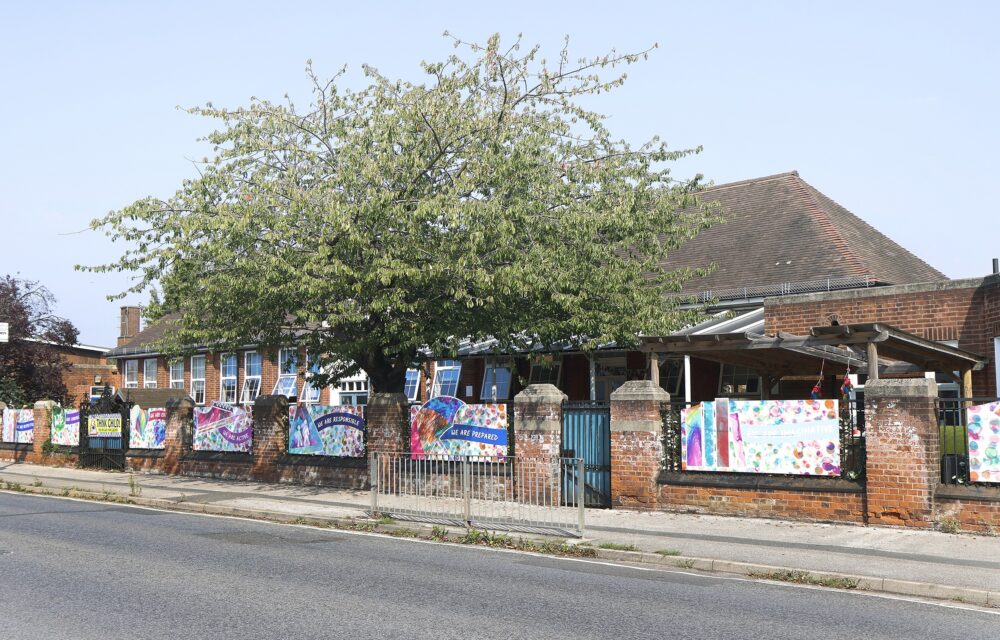 The frontage of Murrayfield Academy school with its colourful array of banners